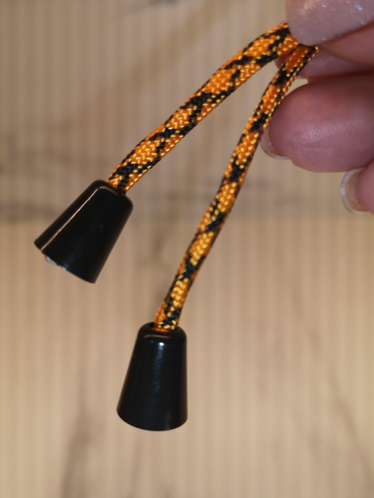 4mm orange/black paracord. 7 Strand