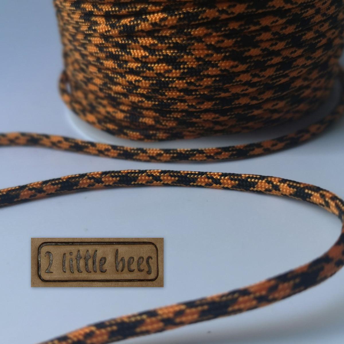 7 core strand paracord rope. Orange black cord