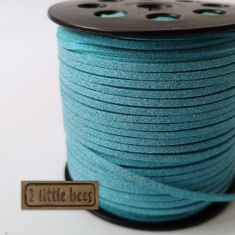 Blue glitter faux suede string