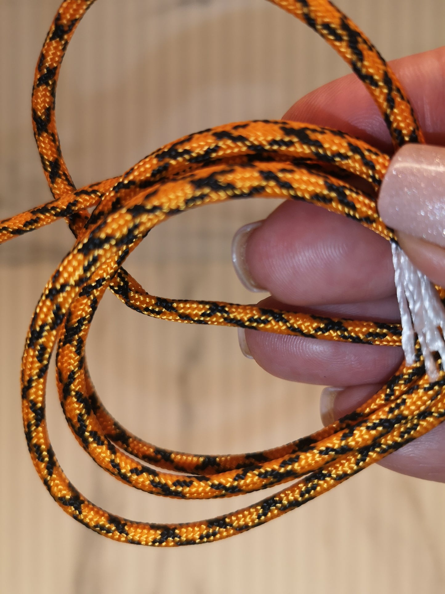 4mm orange/black paracord. 7 Strand