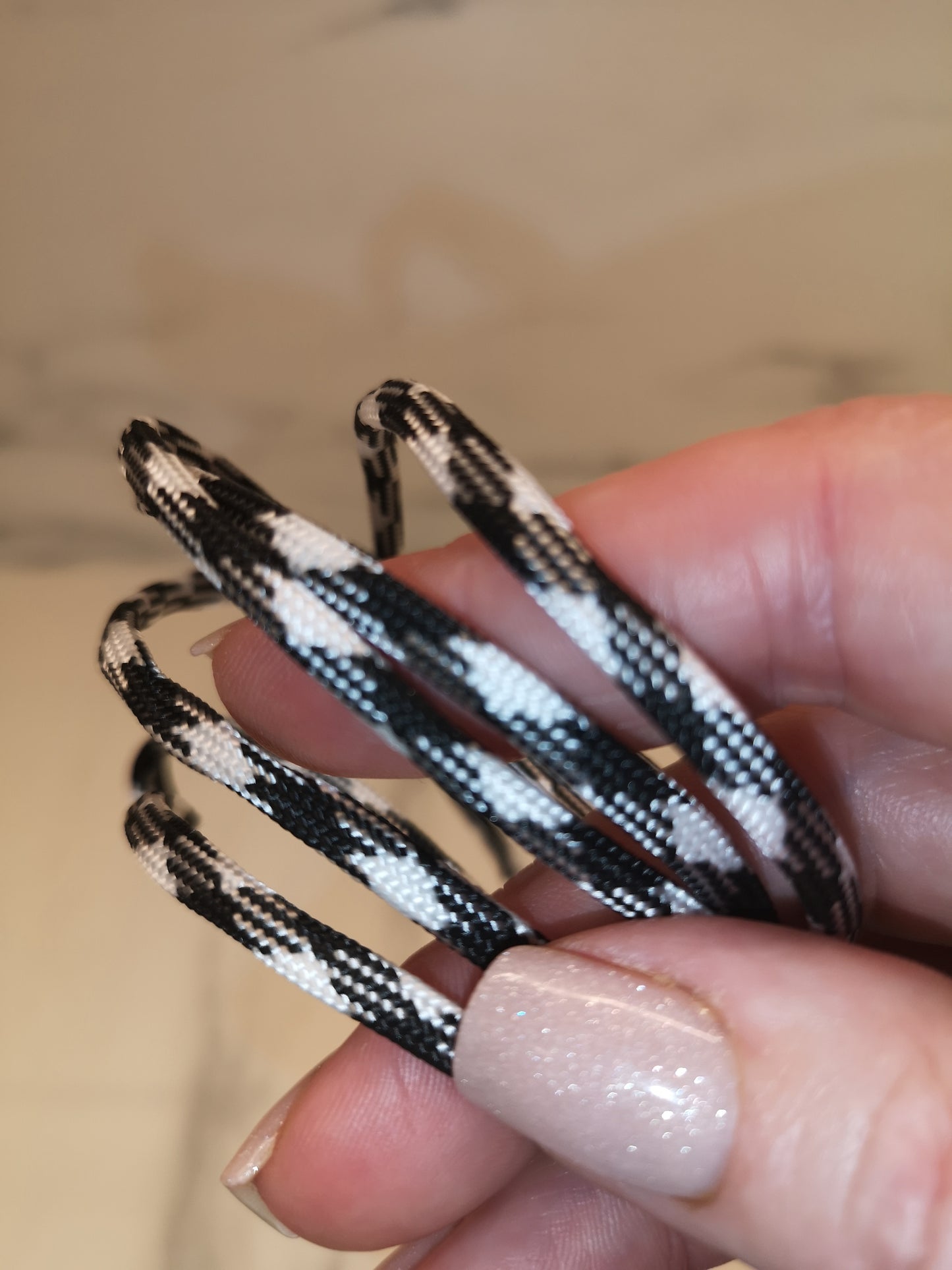 4mm black/white paracord. 7 Strand