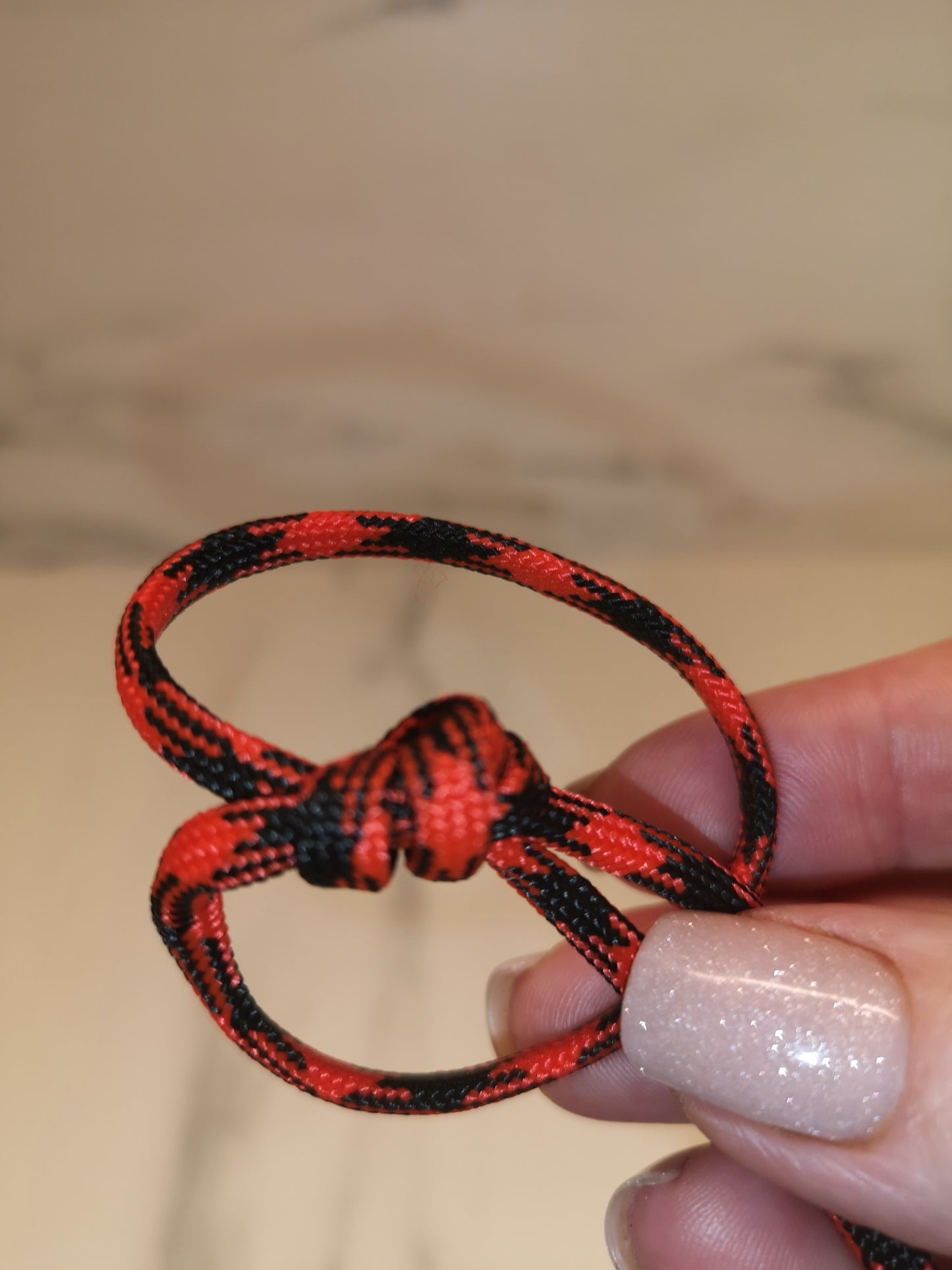 4mm red/black paracord. 7 Strand