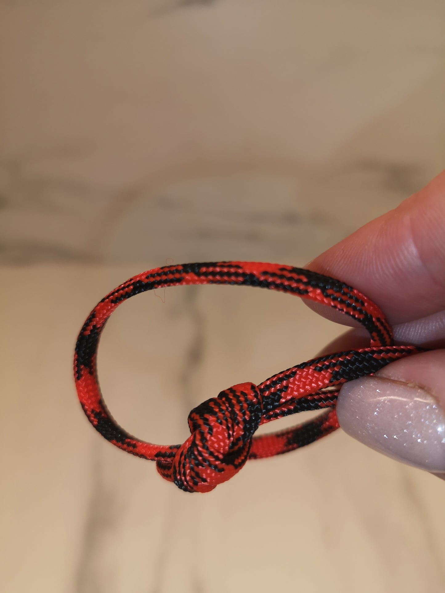 4mm red/black paracord. 7 Strand