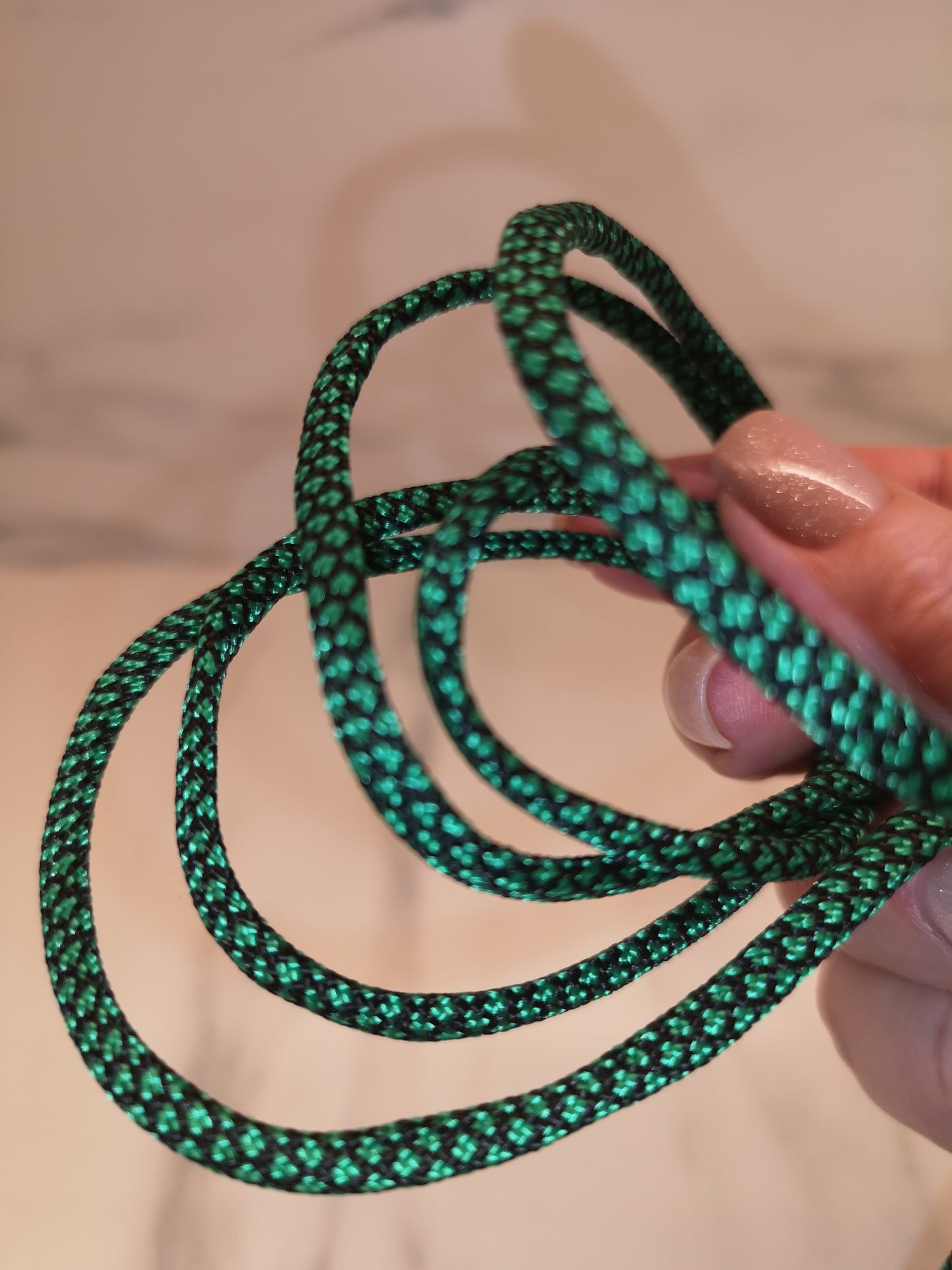 4mm green/black paracord. 7 Strand